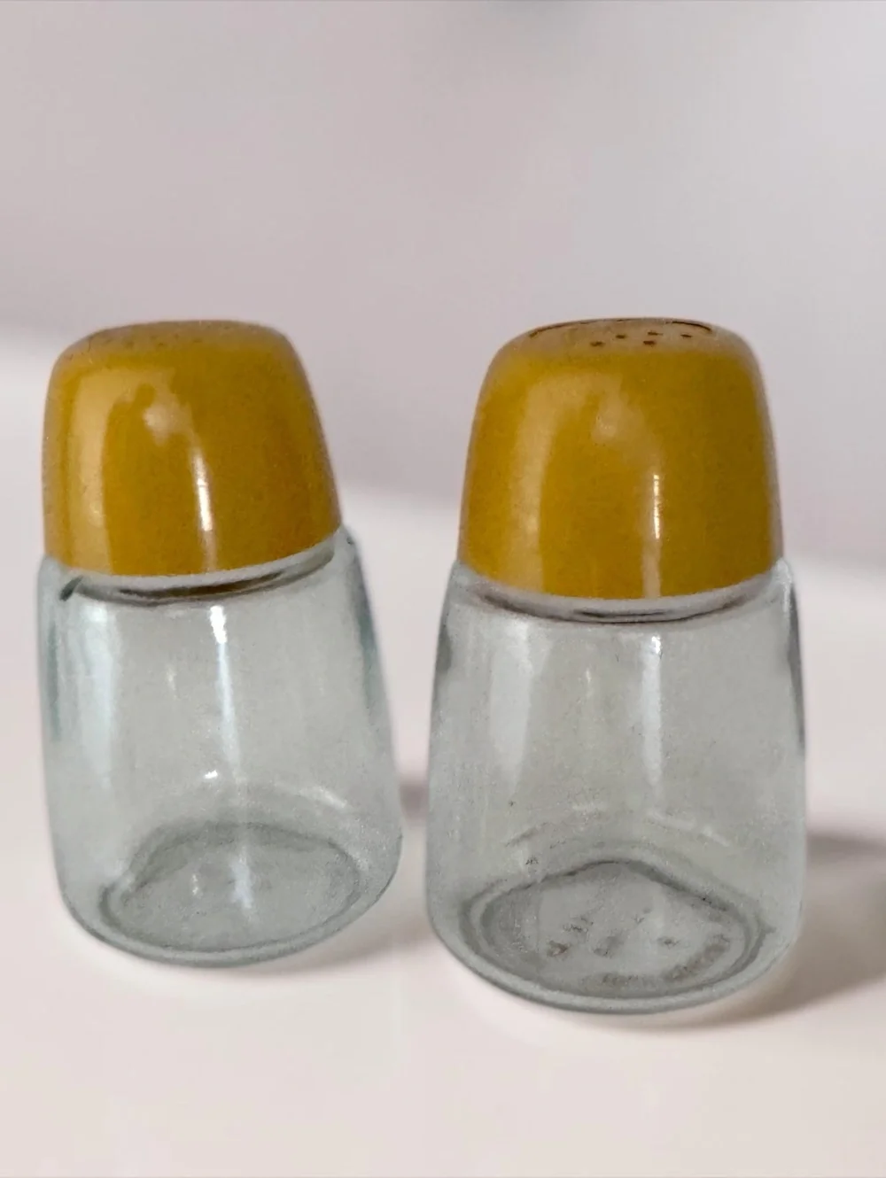 Vintage Mid-Century Modern Glass Salt and Pepper Shakers with Mustard Yellow Lid